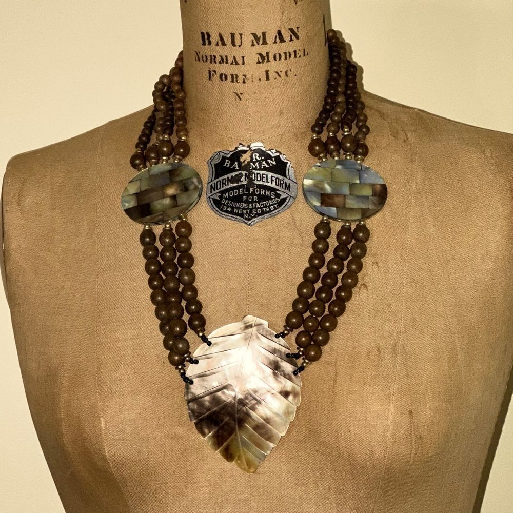 Elegant Brown Wooden Beaded Necklace with Carved Mother of Pearl Leaf Pendant